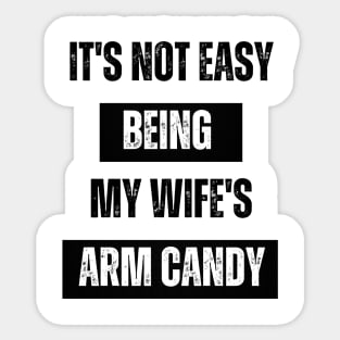 Its not easy being my wife's arm candy t-shirt Sticker